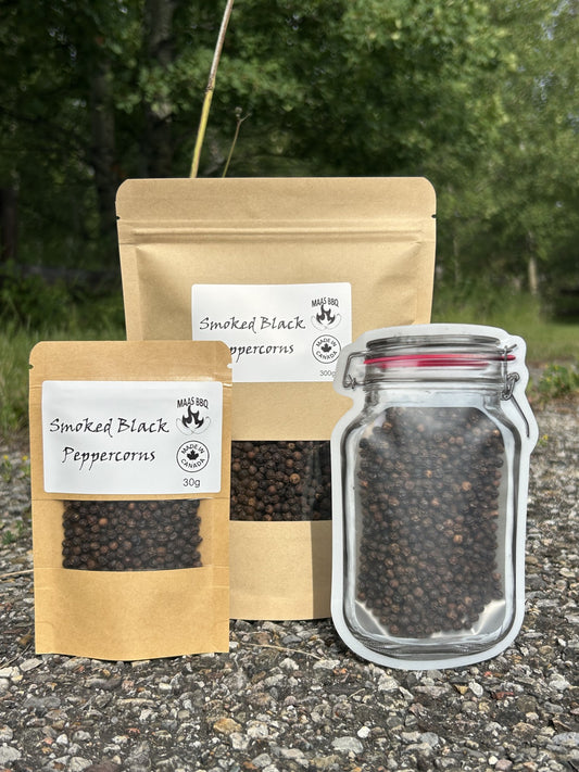 Maas BBQ Smoked Black Peppercorns in three sizes: a 30g pouch, a 300g bulk bag, and a unique mason jar re-sealable pouch. A premium, all-natural smoked black pepper for gourmet cooking. Made in Alberta Canada