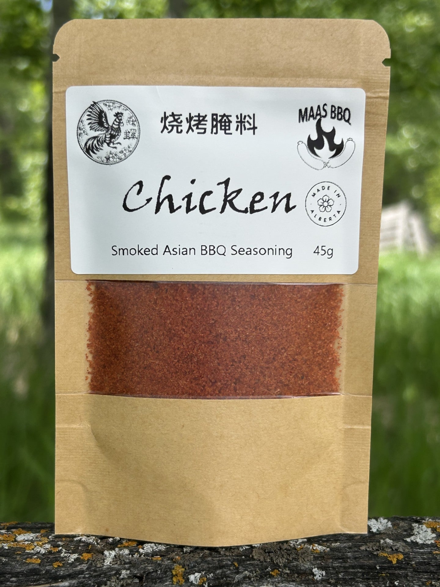 Maas BBQ Smoked Asian Chicken Seasoning shown in a large 454g chef size bag, a 45g trial pouch, and a unique re-sealable mason jar-style pouch. A vibrant red-hued spice blend perfect for chicken and BBQ. Made in Alberta Canada