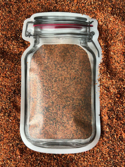 Mason jar pouch filled with Maas BBQ’s famous sugar‑free Asian spice blend, a unique fire & smoke seasoning mix perfect for foodie cooking, recipes, and a great gift for BBQ enthusiasts.