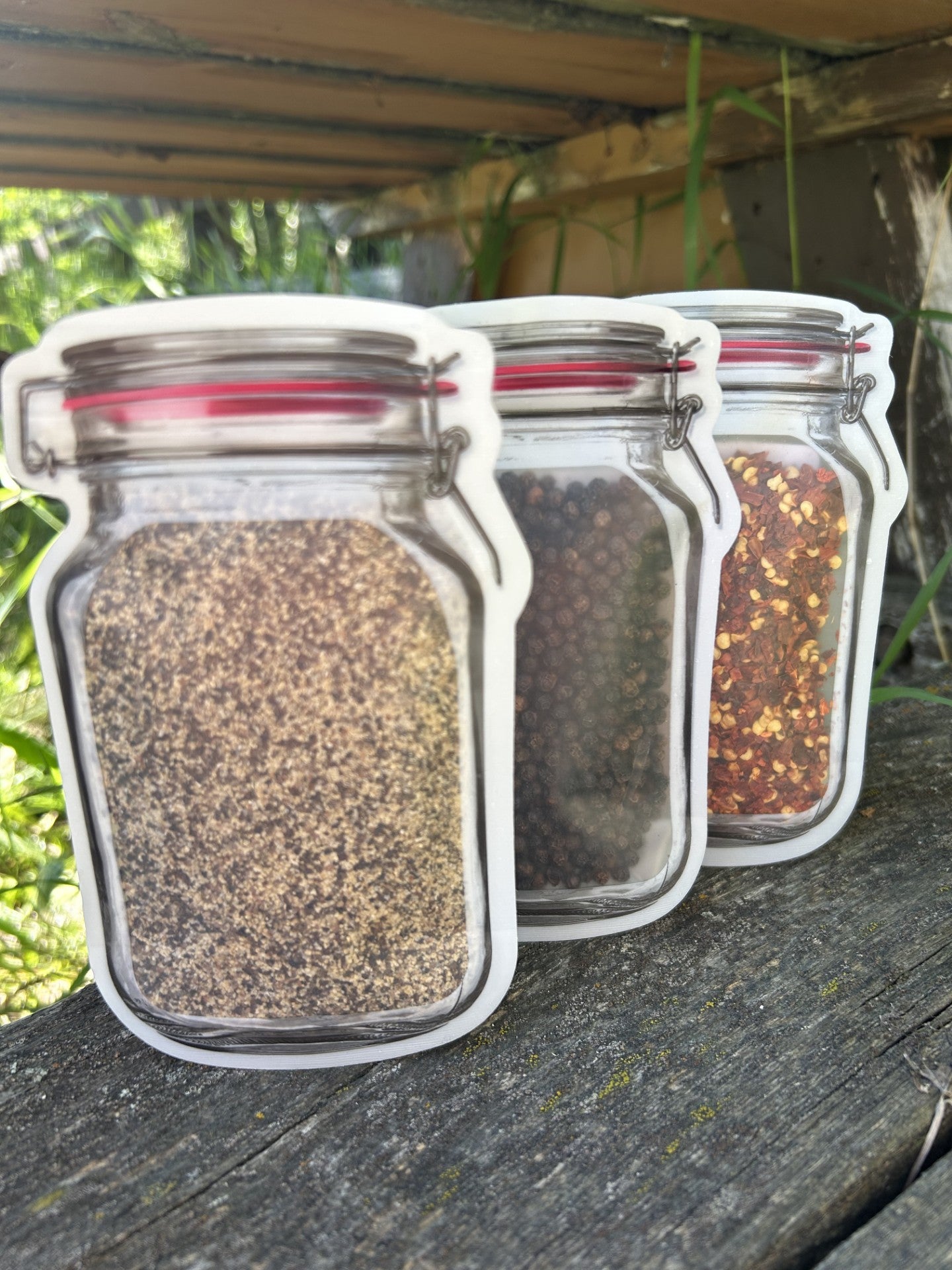 Three mason jar bags containing gourmet smoked SPG seasoning, black peppercorns, and red pepper flakes – Maas BBQ foodie gift set, unique Alberta Canada made cooking spices for BBQ recipes, Canada’s favorite great gift for cooking enthusiasts.