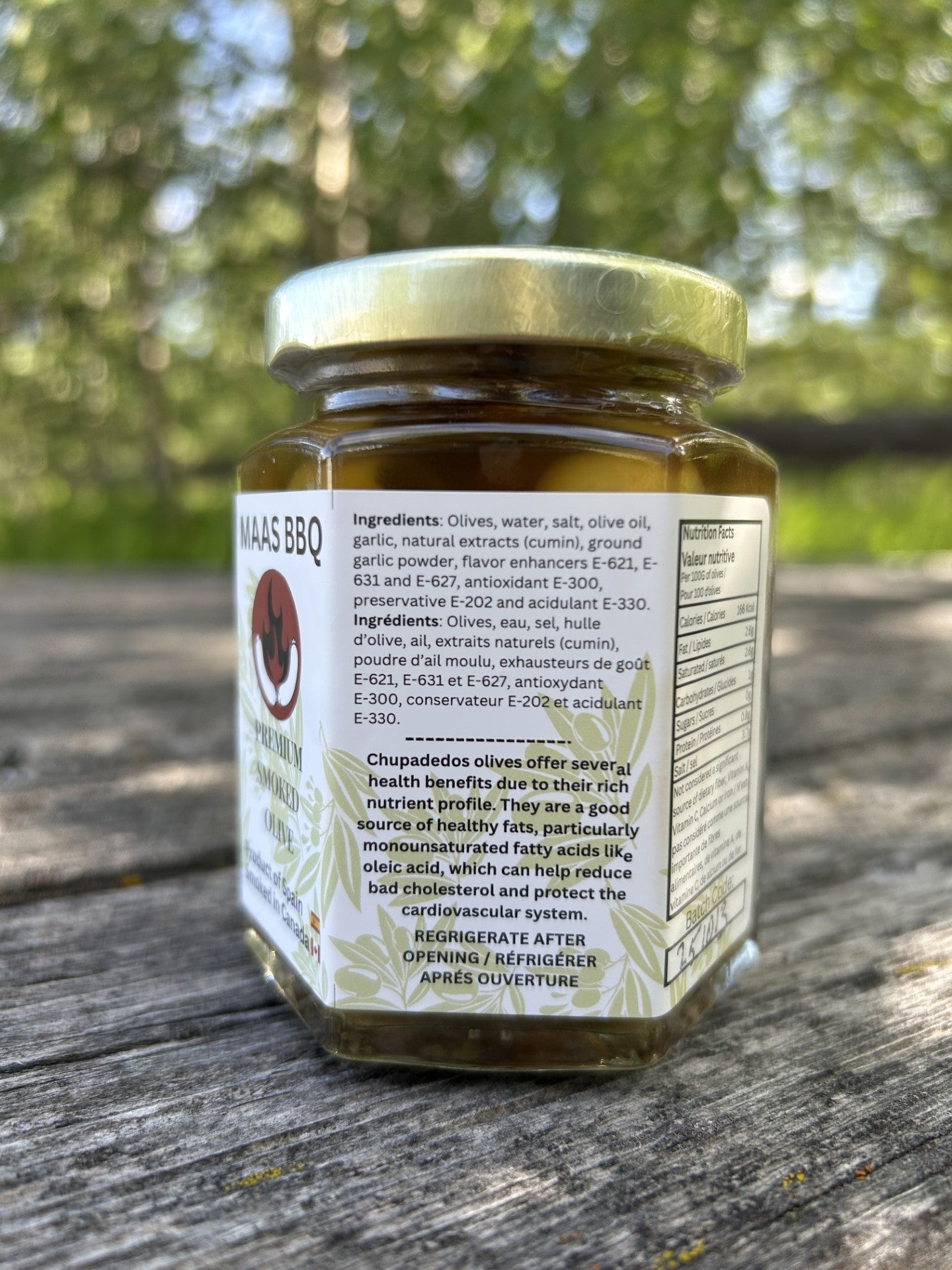 Maas BBQ Premium Smoked Gourmet Olives Canada’s Favorite Smoked Gift for Foodies. Deluxe jar of Maas BBQ Premium Smoked Gourmet Olives, a unique, Alberta‑Canada made, chef‑grade, foodie favorite BBQ smoked olive oil with smoked spices; perfect gourmet cooking ingredient, recipe inspiration, and great executive gift, celebrated as Canada’s favorite premium smoked olive delicacy.