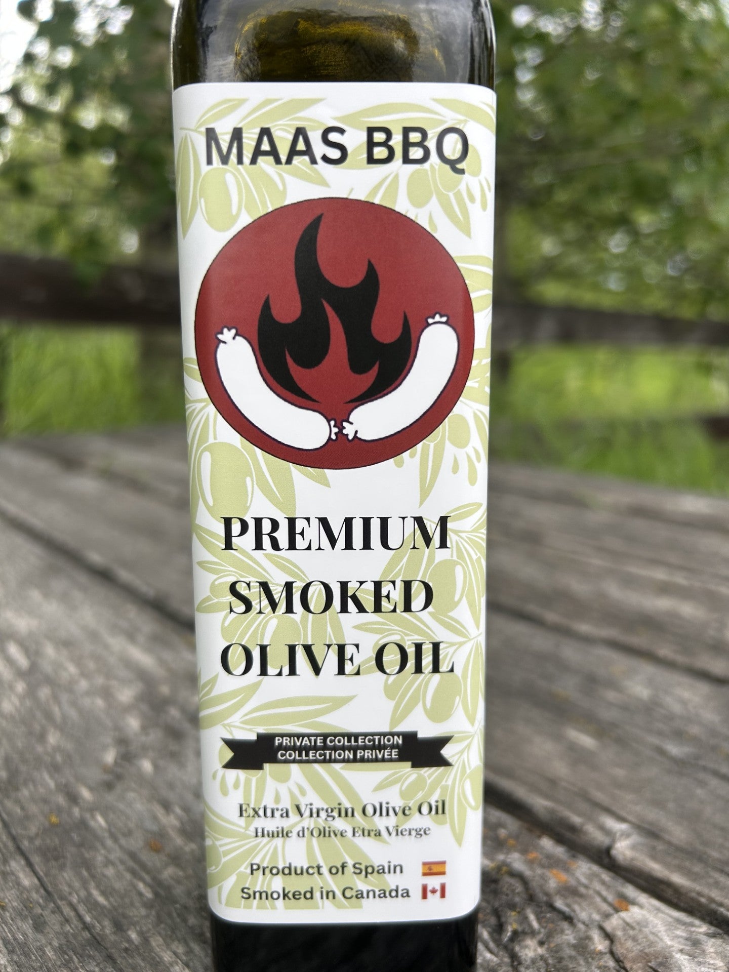 Maas BBQ Premium Smoked Olive Oil bottle, a unique Alberta Canada‑smoked extra‑virgin olive oil blend perfect for foodie chefs to use in BBQ, grilling, dressings, marinades, and gourmet cooking, featuring smoked black pepper flavor – an ideal gift for cooking enthusiasts. Maas BBQ Premium Smoked Olive Oil – Unique Alberta‑Made Cooking Blend for Foodie Chefs | Gift Idea with Smoked Black Pepper Flavor