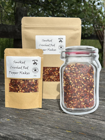 Maas BBQ Premium Smoked Red Pepper Flakes – Canada’s Favorite Unique Smoked Spice for Gourmet Cooking, BBQ Recipes & Foodie Gifts, Made in Alberta. Maas BBQ Smoked Crushed Red Pepper Flakes in various packaging: a 25g kraft pouch, a 170g kraft pouch, and a unique mason jar-shaped pouch, all featuring the "Made in Canada" logo. This premium Alberta‑made gourmet smoked spice is a foodie favorite, perfect for adding unique heat and smoky flavor to cooking and BBQ recipes, and makes a great gift.