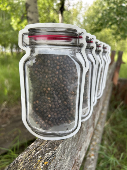 Maas BBQ Smoked Black Peppercorns in a unique mason jar re-sealable pouch. A premium, all-natural smoked black pepper for gourmet cooking.