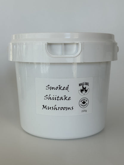 A 220g white bucket of Maas BBQ Smoked Shiitake Mushrooms, featuring the "Made in Canada" logo. This high‑end, unique gourmet ingredient, crafted in Alberta, Canada, is perfect for chefs and foodies to infuse dishes with rich, smoky umami flavors, and makes an excellent executive gift for culinary enthusiasts.