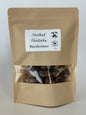 An 70g kraft pouch of Maas BBQ Smoked Shiitake Mushrooms, featuring the "Made in Canada" logo. These high‑end, unique gourmet smoked shiitake mushrooms, crafted in Alberta, Canada, are perfect for chefs and foodies to infuse dishes with rich, smoky umami flavors, and make an excellent gift for culinary enthusiasts.