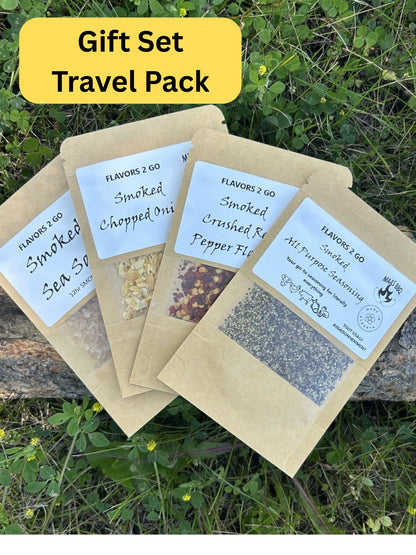 Four brown travel‑size seasoning packs from Maas BBQ labeled 'FLAVORS 2 GO Smoked' with unique flavors – Smoked Sea Salt, Smoked Chopped Onion, Smoked Crushed Red Pepper Flakes, and Smoked All Purpose Seasoning – perfect foodie gift for chefs and BBQ cooking enthusiasts. Maas BBQ Unique Travel‑Size Smoked Seasoning Pack Gift for Foodie Chefs – BBQ Cooking Flavor Packs | FLAVORS 2 GO