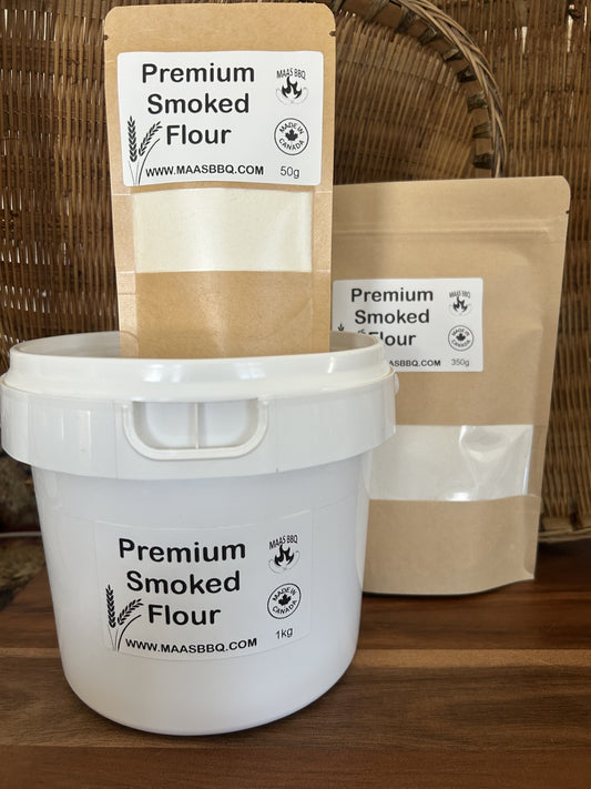 Premium Maas BBQ unique gourmet smoked flour in 50g kraft bag, 350g pouch and 1kg white bucket labeled “Made in Canada”; a high‑end Alberta cooking blend for chefs and foodies to add unique smoked flavors to recipes, ideal as an executive gift for BBQ and gourmet cooking. Premium Maas BBQ Unique Gourmet Smoked Flour – High‑End Alberta‑Made Cooking Blend for Chefs & Foodies (Perfect Gift for Executive BBQ Lovers)