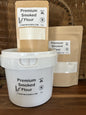 Premium Maas BBQ unique gourmet smoked flour in 50g kraft bag, 350g pouch and 1kg white bucket labeled “Made in Canada”; a high‑end Alberta cooking blend for chefs and foodies to add unique smoked flavors to recipes, ideal as an executive gift for BBQ and gourmet cooking. Premium Maas BBQ Unique Gourmet Smoked Flour – High‑End Alberta‑Made Cooking Blend for Chefs & Foodies (Perfect Gift for Executive BBQ Lovers)