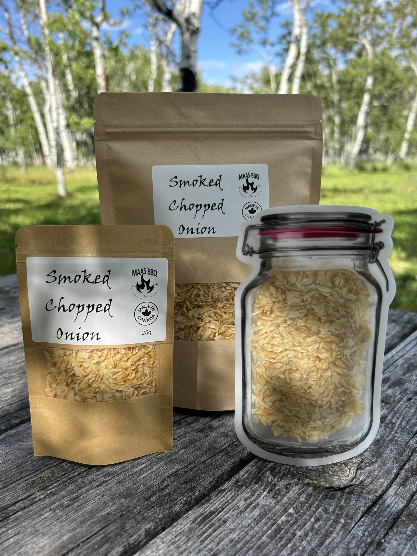 Chopped onion pouches with golden yellow smoked onion flakes by Maas BBQ. Regular paper pouch, chef size bag and luxury gourmet mason jar pouch