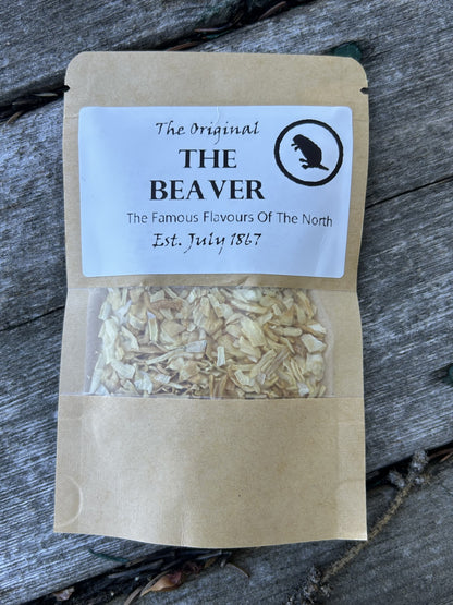 Brown kraft pouch with clear window showing smoked onion flakes, labeled “The Original THE BEAVER – The Famous Flavours Of The North, Est. July 1867,” a unique Maas BBQ foodie gift made in Alberta Canada for cooking, BBQ recipes, and great gift ideas – True North onion flake seasoning.