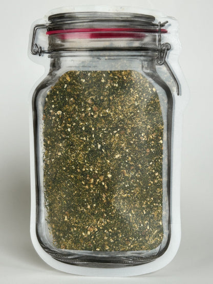 Re‑sealable mason jar pouch filled with a unique Maas BBQ dock and dine seafood spice blend, a flavorful foodie gift.