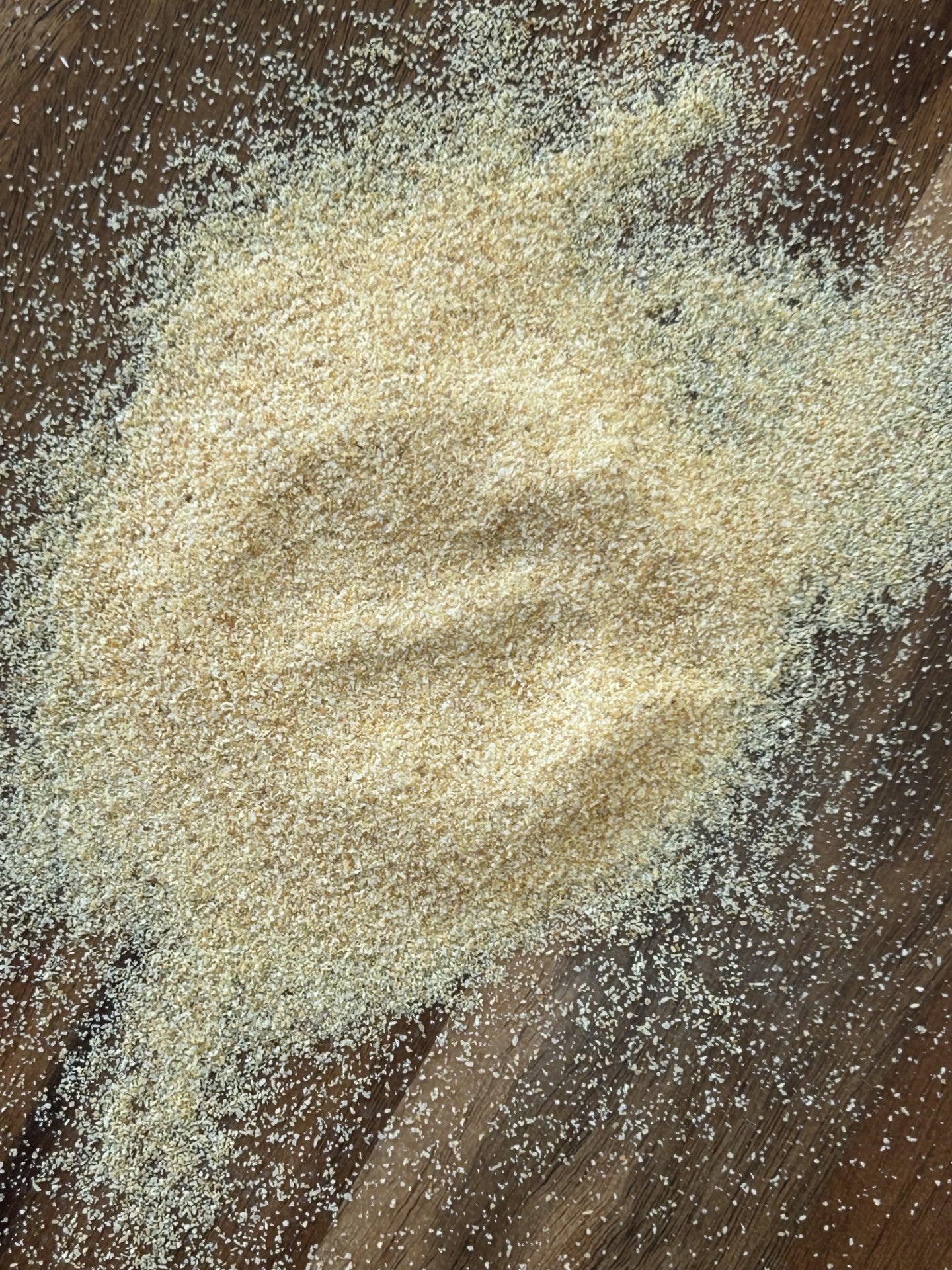 A close‑up of Maas BBQ unique gourmet smoked Onion powder, a high‑end Alberta‑made blend for chefs and foodies. This exclusive smoked onion powder is perfect for adding unique flavors to cooking, BBQ, and savory dishes, and makes an exceptional gift.