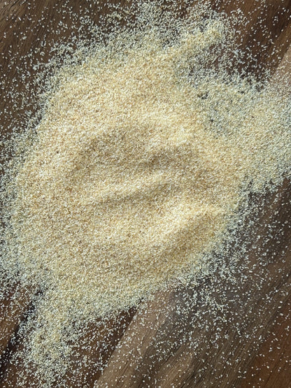 A close‑up of Maas BBQ unique gourmet smoked Onion powder, a high‑end Alberta‑made blend for chefs and foodies. This exclusive smoked onion powder is perfect for adding unique flavors to cooking, BBQ, and savory dishes, and makes an exceptional gift.